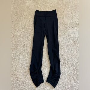 Black Lululemon leggings with rushing at the bottom